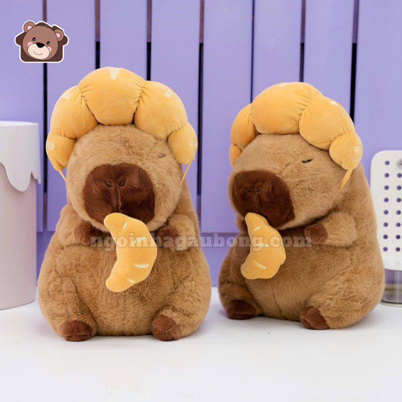 Gấu Bông Capybara Đội Bánh Sừng Bò