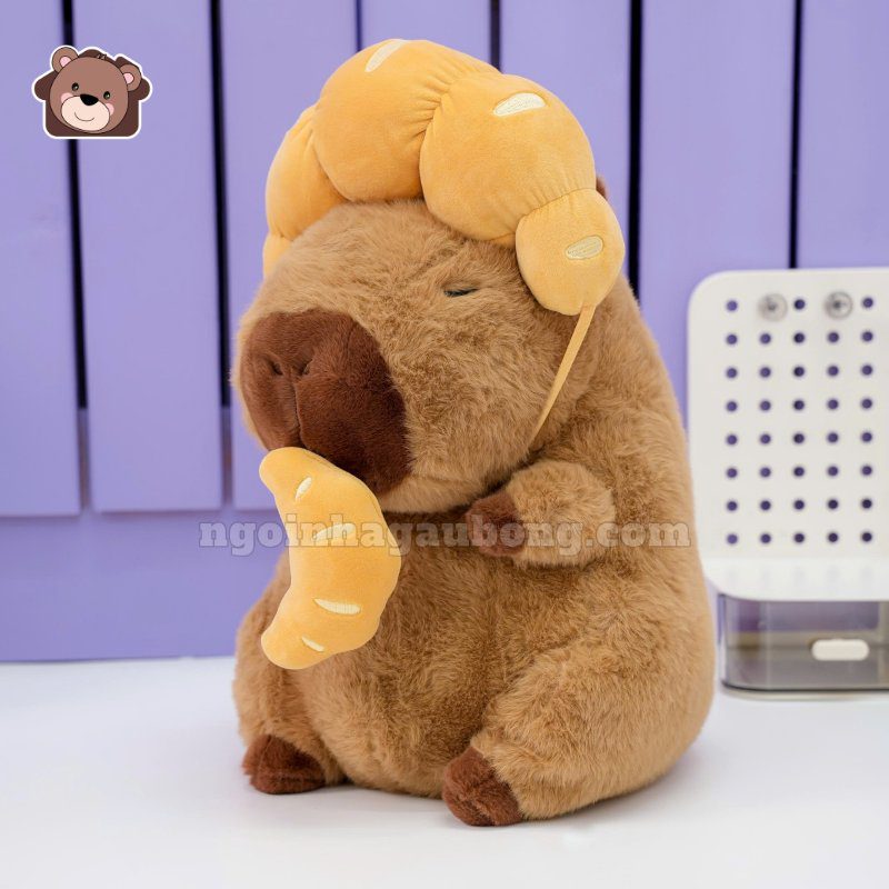Gấu Bông Capybara Đội Bánh Sừng Bò