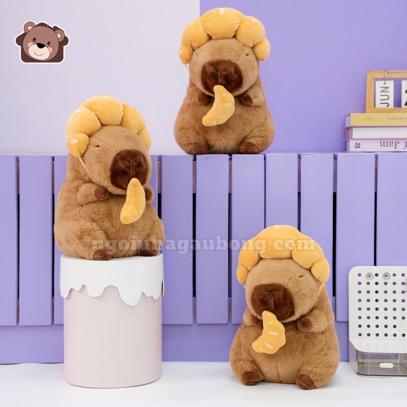 Gấu Bông Capybara Đội Bánh Sừng Bò
